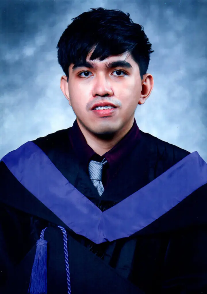 Picture of myself wearing graduation uniform year 2021.